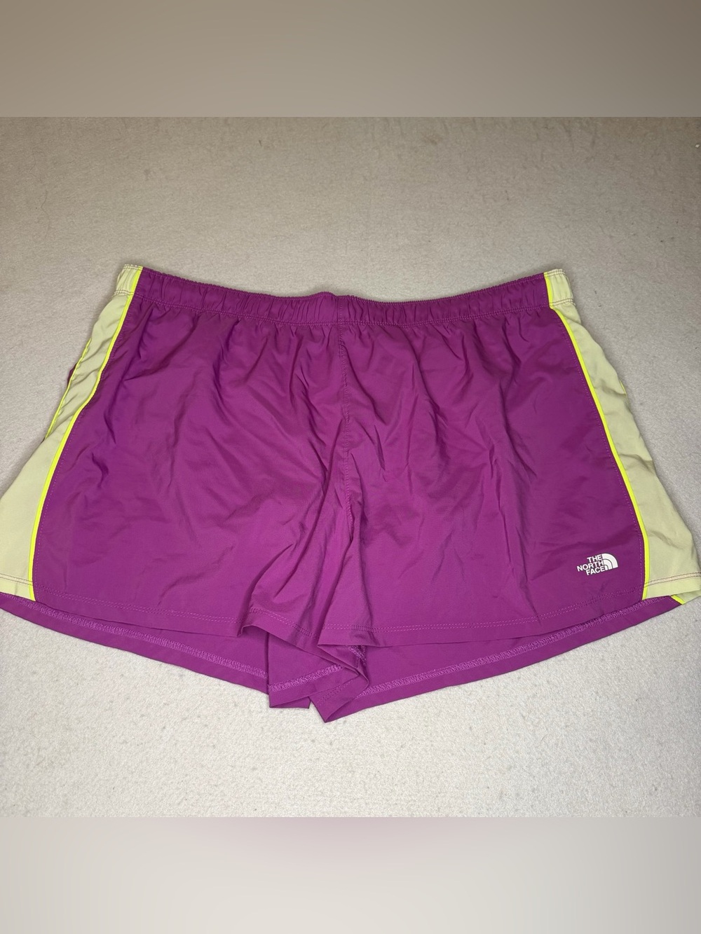 The North Face Women's Magenta Running Shorts with Yellow Accent